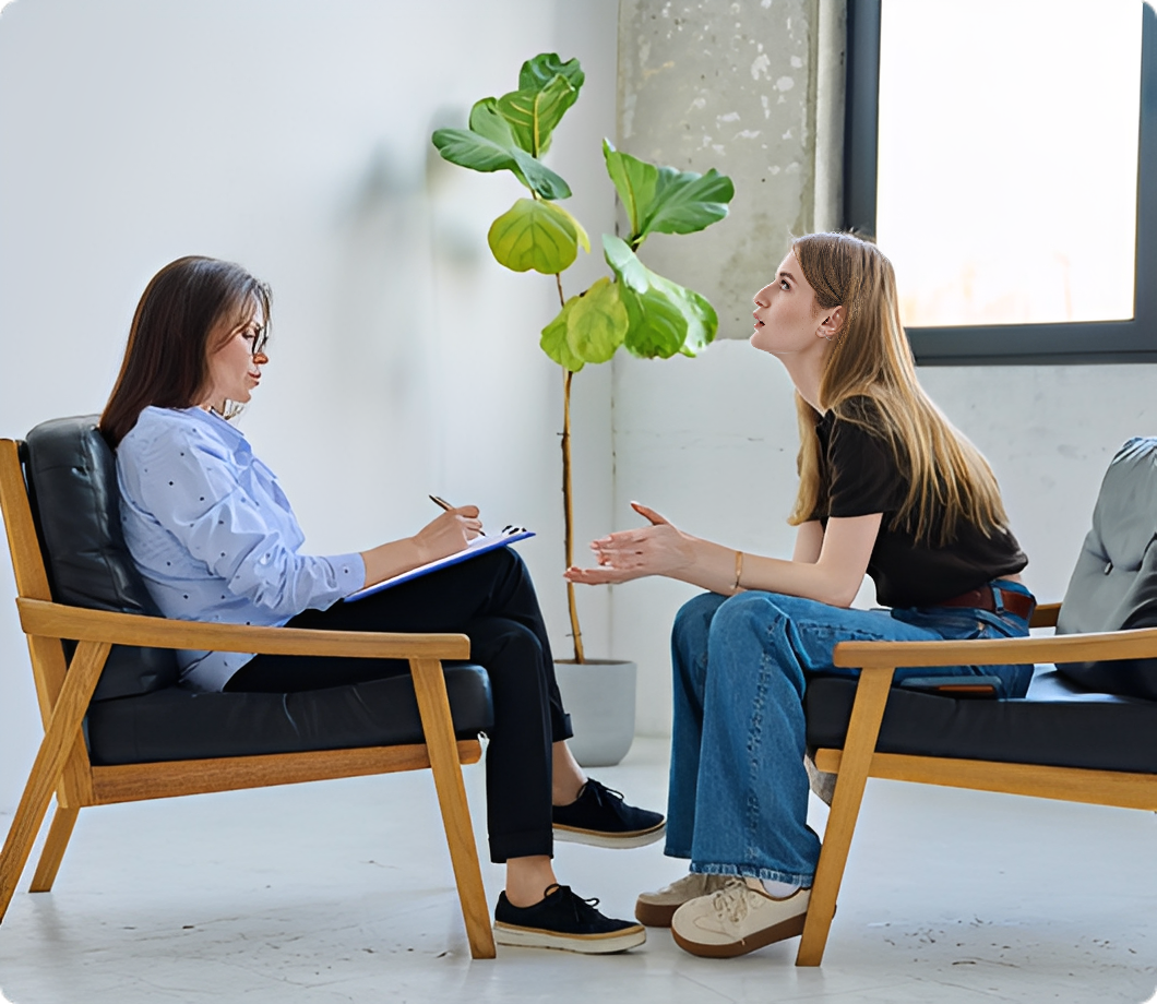 Woman discussing with therapist indoors